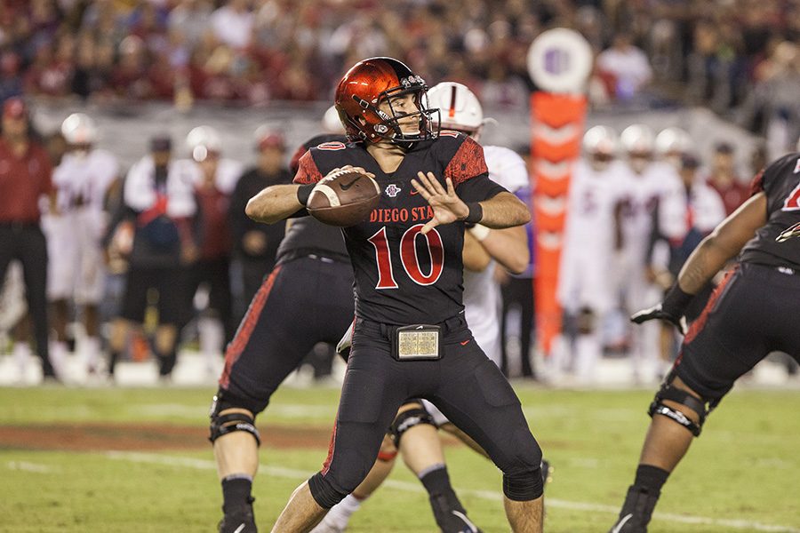 Redshirt junior quarterback Christian Chapman pulls back for a pass during SDSU’s win over Stanford on Sept. 16, 2017.