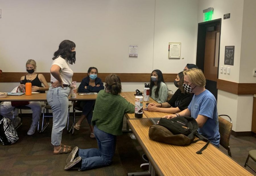The president of Mock Trial, Sophie Jeltema (in white),  talking to new members during the first meeting in person.  