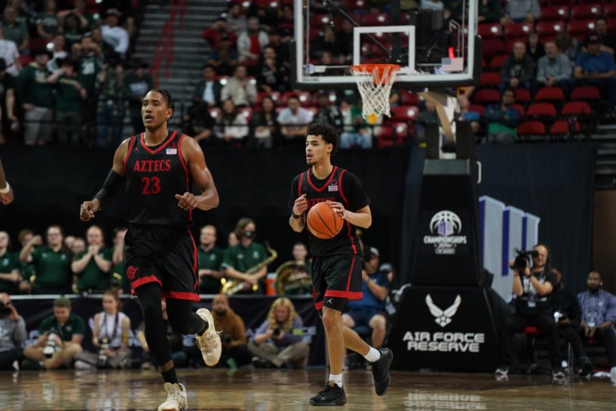 Joshua Tomaic (left) and Trey Pulliam (right) go down the court during the 2022 Mountain West Tournament. Pulliam scored 14 points on 6-of-14 shooting during SDSU's 72-69 loss in the first round of the NCAA Tournament.