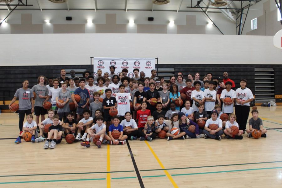 The SDSU Aztec men's and women's basketball players with the Boys and Girls Club at Assist 2023.