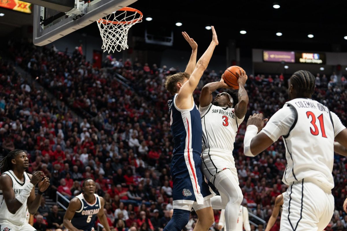 San Diego State senior guard Wayne McKinney III attempts a layup against a Gonzaga Bulldog defender earlier this season at Viejas Arena. 