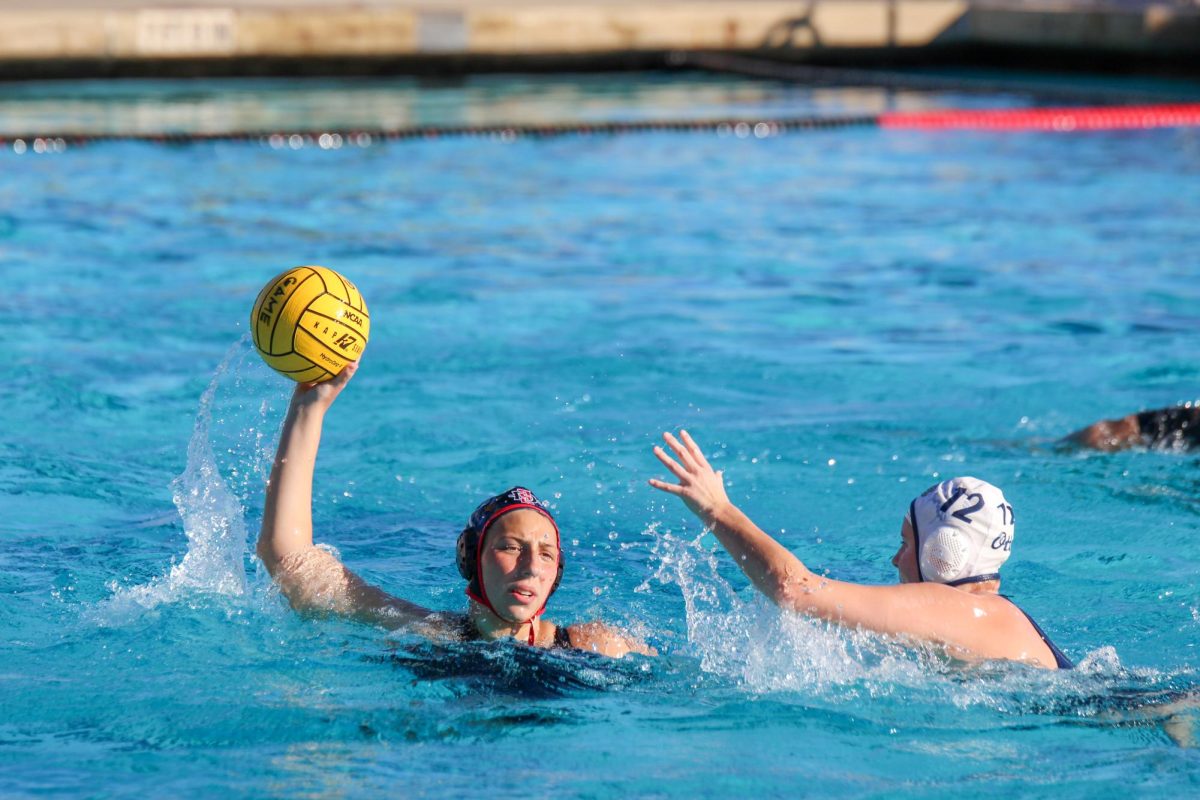 San Diego State attacker Claudia Valdes looks to keep the ball away from a defender against CSU Monterey Bay last season at the Aztec Aquaplex. 