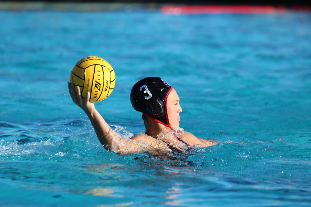 San Diego State attacker Amanda Chambers looks ahead while in possession of the ball during a water polo match versus Cal State Monterey Bay on Feb. 10. 