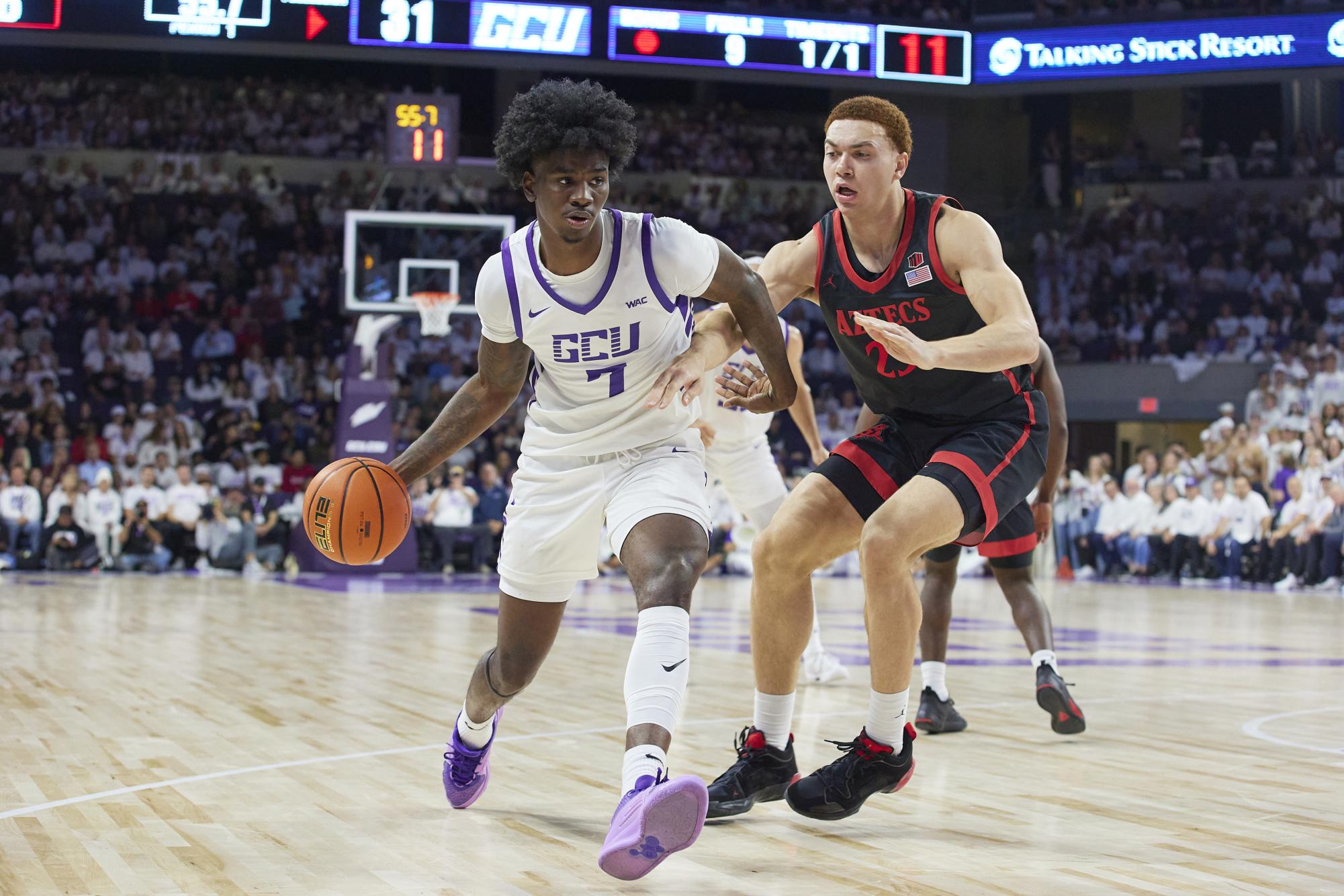 Former SDSU forward Elijah Saunders cuts off a GCU basketball player in the schools' most recent matchup on Dec. 5, 2023. Photo Courtesy of David Kadlubowski/GCU